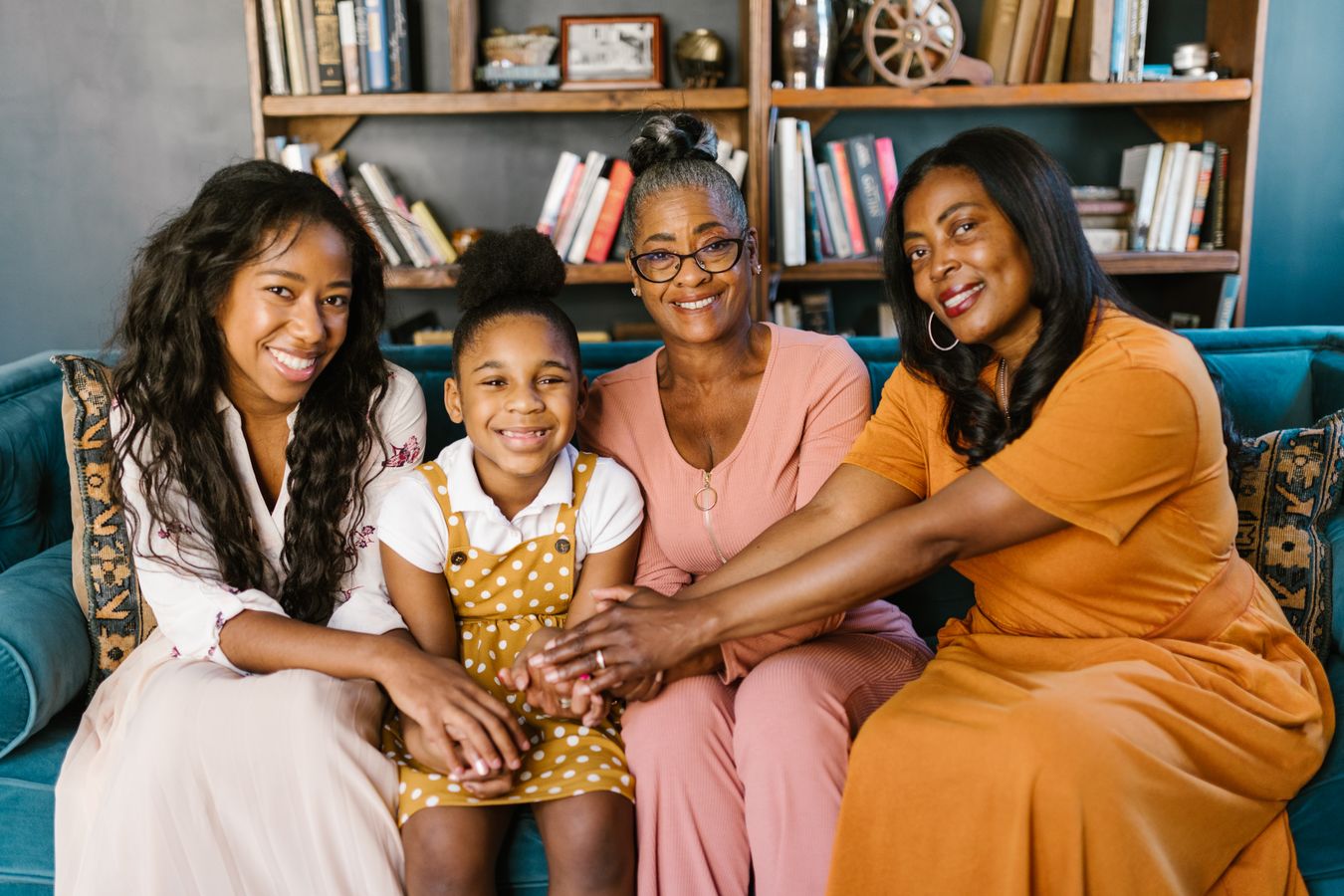 A multigenerational African American family sharing a relaxed moment at home